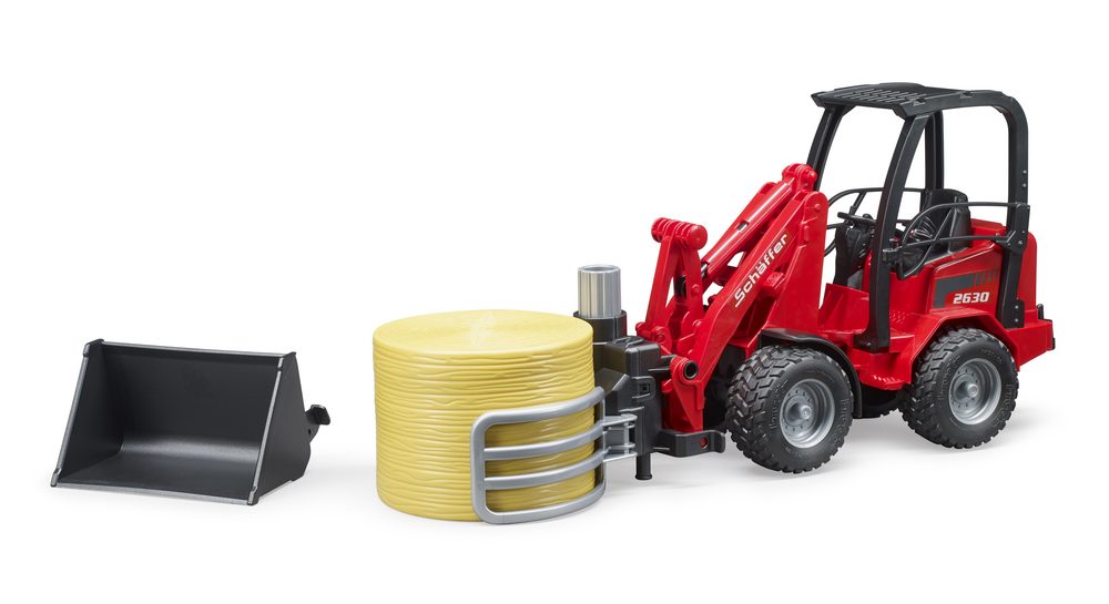 Schäffer Compact loader 2630 with bale gripper and round bale — Bruder 02192